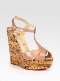 Textured cork wedge and platform support this patent leather t-strap silhouette with an adjustable ankle strap and signature red leather sole. Cork wedge, 5 (125mm)Cork platform, 1 (25mm)Compares to a 4 heel (100mm)Patent leather upperLeather liningSignature red leather solePadded insoleImportedOUR FIT MODEL RECOMMENDS ordering one size up as this style runs small. Textured cork wedge and platform support this patent leather t-strap silhouette with an adjustable ankle strap and signature red leather sole. Cork wedge, 5 (125mm)Cork platform, 1 (25mm)Compares to a 4 heel (100mm)Patent leather upperLeather liningSignature red leather solePadded insoleImportedOUR FIT MODEL RECOMMENDS ordering one size up as this style runs small.