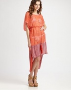 An ethereal design with down-to-earth style, thanks to classic stripes, exotic tassels and a fashion-forward high-low hem.Round neckKimono sleevesSolid trimSelf-tie tassel beltHigh-low hemSilkHand washImported