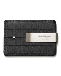 This combination credit card holder and moneyclip is adorned with an embossed logo pattern and an etched silvertone clip. This combination credit card holder and moneyclip is adorned with an embossed logo pattern and an etched silvertone clip.