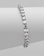 EXCLUSIVELY AT SAKS. Clear cubic zirconia stones in a classic tennis bracelet design.Cubic zirconia Rhodium plated sterling silver Length, about 7 Push lock closure Imported 