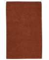 Create a luxurious foundation with a rich, felted wool rug in a deep rust hue. This plush piece features an undeniably soft hand, created with the finest hand-woven New Zealand wool.