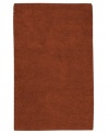 Create a luxurious foundation with a rich, felted wool rug in a deep rust hue. This plush piece features an undeniably soft hand, created with the finest hand-woven New Zealand wool.