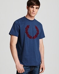 Emblazoned with a large graphic of Fred Perry's signature logo, this soft tee gives you a reliable option to pair with shorts or jeans. Emblazoned with a large graphic of Fred Perry's signature logo, this soft tee gives you a reliable option to pair with shorts or jeans.