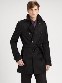 The classic double-beasted trench in a sleek, rain-resistant poly-cotton blend.Notch collarEpaulettesStorm flapsDouble-breasted button frontBuckle-strap cuffsSelf-beltButton welt pocketsBack shoulder ventInverted back pleat below waistAbout 33 from shoulder to hem65% polyester/35% cottonFully linedDry cleanImported The classic double-beasted trench in a sleek, rain-resistant poly-cotton blend.Notch collarEpaulettesStorm flapsDouble-breasted button frontBuckle-strap cuffsSelf-beltButton welt pocketsBack shoulder ventInverted back pleat below waistAbout 33 from shoulder to hem65% polyester/35% cottonFully linedDry cleanImported