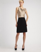 A polished woven design tailored with a hint of stretch for a perfect fit.Smooth front Side zipper Back waist pleats Inverted back pleat at hem About 22 long 97% polyester/3% spandex Dry clean Imported
