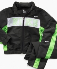 Team Nike just added another member - your little guy. This jacket and pant warm-up combination will fast-track him to style stardom. Team Nike just added another member - your little guy. This jacket and pant warm-up combination will fast-track him to style stardom.
