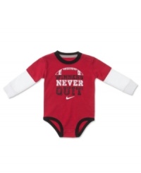 This Nike bodysuit boasts a winning slogan for your little athlete. This Nike bodysuit boasts a winning slogan for your little athlete.