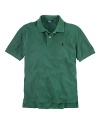 A classic polo shirt crafted from breathable cotton mesh is tailored in a short-sleeved silhouette for preppy, warm-weather style.