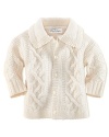 Rendered in luxuriously soft merino wool, a cable-knit cardigan has a classic and cozy feel.