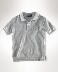 Essential short-sleeved polo shirt in our breathable cotton mesh. Ribbed polo collar and armbands. Uneven vented hem. Signature embroidered pony accents the chest. Essential short-sleeved polo shirt in our breathable cotton mesh. Ribbed polo collar and armbands. Uneven vented hem. Signature embroidered pony accents the chest.