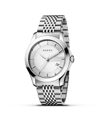 A stainless steel watch from the Gucci G-Timeless collection. Round silver dial with pattern and stick hour indices. Sweep second hand and date window. A stainless steel watch from the Gucci G-Timeless collection. Round silver dial with pattern and stick hour indices. Sweep second hand and date window.