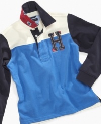 Who says a rugby shirt has to be striped? Tommy Hilfiger outfits this season's star player in a sturdy cotton shirt styled with color blocking and championship graphics. Who says a rugby shirt has to be striped? Tommy Hilfiger outfits this season's star player in a sturdy cotton shirt styled with color blocking and championship graphics.