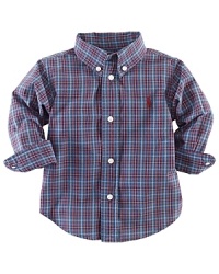 A tried-and-true button-front design is rendered in a vibrant madras plaid. A tried-and-true button-front design is rendered in a vibrant madras plaid.
