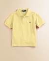 Classic, short-sleeve cotton mesh polo with embroidered polo pony on the chest. Ribbed polo collar and armbands Button placket Machine wash Imported