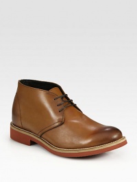 Superb craftsmanship with a burnished feel, in a smooth leather lace-up design with a rubber-lug sole.Leather upperLeather liningPadded insoleRubber soleMade in Italy Superb craftsmanship with a burnished feel, in a smooth leather lace-up design with a rubber-lug sole.Leather upperLeather liningPadded insoleRubber soleMade in Italy
