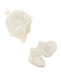A preppy cable knit lends timeless polish to a hat-and-mitten set rendered in soft merino wool. A preppy cable knit lends timeless polish to a hat-and-mitten set rendered in soft merino wool.
