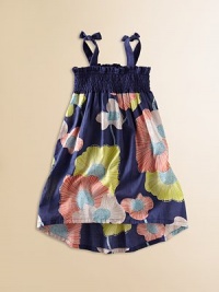 A Hawaiian-inspired surf lily print adds a bold splash of color to this airy, breezy cotton frock with shoulder ties.SquareneckSleevelessPull-on style with shoulder tiesGathered smocked bodiceHem shorter in front and longer in backCottonMachine washImported A Hawaiian-inspired surf lily print adds a bold splash of color to this airy, breezy cotton frock with shoulder ties.SquareneckSleevelessPull-on style with shoulder tiesGathered smocked bodiceHem shorter in front and longer in backCottonMachine washImported