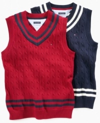Tennis anyone? Tommy Hilfiger serves up the classic cabled sweater vest-complete with double-striped V-neck-in grand slam style. Tennis anyone? Tommy Hilfiger serves up the classic cabled sweater vest-complete with double-striped V-neck-in grand slam style.