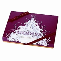 Celebrate the holidays with an assortment of decadent Godiva chocolates packaged in a whimiscal-themed red box. The 36 piece classic Belgian chocolate assortment includes everyday and limited edition seasonal truffles. Celebrate the holidays with an assortment of decadent Godiva chocolates packaged in a whimiscal-themed red box. The 36 piece classic Belgian chocolate assortment includes everyday and limited edition seasonal truffles.