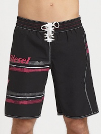 A classic beach essential, in quick-drying nylon, finished with brilliant color and logo detail.Elastic drawstring-tie waistRear welt pocketInseam, about 10PolyesterMachine washImported A classic beach essential, in quick-drying nylon, finished with brilliant color and logo detail.Elastic drawstring-tie waistRear welt pocketInseam, about 10PolyesterMachine washImported