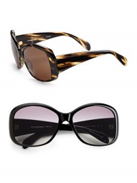 Large feminine frames handcrafted of rounded plastic with thick contoured temples. Available in cocobolo with brown polar lens or black with grey polar lens. 100% UV protection Imported Large feminine frames handcrafted of rounded plastic with thick contoured temples. Available in cocobolo with brown polar lens or black with grey polar lens. 100% UV protection Imported