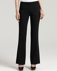 Bring timeless chic to the workday in these Elie Tahari straight-leg pants. Bring timeless chic to the workday in these Elie Tahari straight-leg pants.