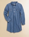 A go-with-anything wardrobe essential, the denim chambray shirt dress is classic and cool with signature embroidery in a snap-front design.Shirt collarLong sleeves with roll-tab snap cuffsSnap-frontFront snap-flap pocketsBack yokeShirttail hemCottonMachine washImported Please note: Number of snaps may vary depending on size ordered. 