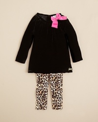 A glamorous top and legging set is soft velvet and cheetah print, with a hot pink bow at the shoulder. A glamorous top and legging set is soft velvet and cheetah print, with a hot pink bow at the shoulder.