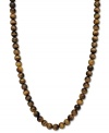 A lovely gradation of neutral hues. This beautiful strand necklace features tiger's eye beads (190 ct. t.w.) in a polished 14k gold setting. Approximate length: 18 inches. Approximate bead diameter: 8-9 mm.