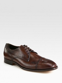 Vintage-inspired brogue details frame an oxford wingtip crafted of soft, burnished leather. Leather upperLeather liningPadded insoleLeather soleMade in Italy Vintage-inspired brogue details frame an oxford wingtip crafted of soft, burnished leather. Leather upperLeather liningPadded insoleLeather soleMade in Italy