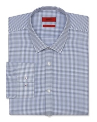 A slim fit HUGO dress shirt touts a plaid pattern and traditional barrel cuffs for streamlined office polish. A slim fit HUGO dress shirt touts a plaid pattern and traditional barrel cuffs for streamlined office polish.