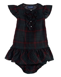 A festive plaid pattern graces this ruffle-trimmed dress. A festive plaid pattern graces this ruffle-trimmed dress.
