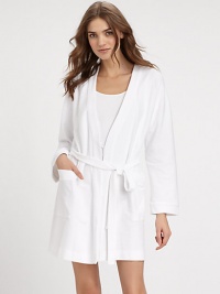 Wrap yourself in this waffled cotton piqué design, with elasticized waistband and long sleeves for superior fit and comfort. V-neckLong sleevesTrim piping at the neckline and cuffsElasticized waistband with attached self-tie beltDual front patch pocketsAbout 35½ from shoulder to hemCottonMachine washImported Wrap yourself in this waffled cotton piqué design, with elasticized waistband and long sleeves for superior fit and comfort. V-neckLong sleevesTrim piping at the neckline and cuffsElasticized waistband with attached self-tie beltDual front patch pocketsAbout 35½ from shoulder to hemCottonMachine washImported