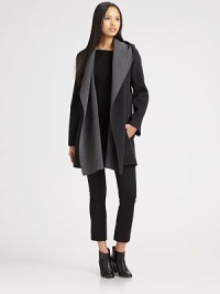 Rich wool crepe, draped and styled with a shawl collar and hood, slightly oversized for a cozy fit.HoodDraped shawl collarOpen frontSlash pocketsAbout 25 from shoulder to hem90% wool/10% nylonDry cleanImportedModel shown is 5'11 (180cm) wearing US size Small. Rich wool crepe, draped and styled with a shawl collar and hood, slightly oversized for a cozy fit.HoodDraped shawl collarOpen frontSlash pocketsAbout 25 from shoulder to hem90% wool/10% nylonDry cleanImportedModel shown is 5'11 (180cm) wearing US size Small.