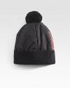Nylon and wool puffer hat with pom pom detail.Ribbed hemNylon/woolDry cleanMade in Italy