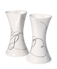 Spark some romance. A loopy platinum design and heart-shaped openings define Love Story candle holders with elegant whimsy. In lustrous white porcelain from Mikasa. Spark some romance. A loopy platinum design and heart-shaped openings define Love Story candle holders with elegant whimsy. In lustrous white porcelain from Mikasa.