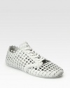 Sporty, modern lace-up design in woven leather.Leather liningPadded insoleRubber soleImported