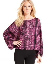 Vince Camuto combines a head-turning print with a knockout silhouette for this latest blouse. Vince Camuto combines a head-turning print with a knockout silhouette for this latest blouse.