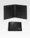 Leather bi-fold wallet accented with Made in Italy by Gucci script gold engraving. Two bill compartmentsSix card slotsClosed: 4.3W x 3.5H x .6DOpen: 8.4W x 3.5HMade in Italy