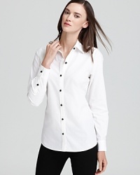 Steeped in nautical inspiration, this Vineyard Vines shirt anchors in the maritime trend with a crisp, white silhouette accented with rope-knot buttons. Steeped in nautical inspiration, this Vineyard Vines shirt anchors in the maritime trend with a crisp, white silhouette accented with rope-knot buttons.