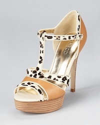 In luxe leather and leopard print calf hair, these standout GUESS sandals make a daring statement after hours. In luxe leather and leopard print calf hair, these standout GUESS sandals make a daring statement after hours.