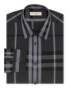 A broad check pattern blending tonal hues distinguishes this handsome dress shirt from Burberry.