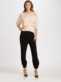 This comfortable design is embellished with a gathered neckline and chic rows of buttons at each shoulder.Gathered necklineShoulder buttonsThree-quarter dolman sleevesRib-knit cuffsBanded, elastic waistLoose peplum-style hemlineViscoseDry cleanMade in France of imported fabricModel shown is 5'11 (180cm) wearing US size 4. This comfortable design is embellished with a gathered neckline and chic rows of buttons at each shoulder.Gathered necklineShoulder buttonsThree-quarter dolman sleevesRib-knit cuffsBanded, elastic waistLoose peplum-style hemlineViscoseDry cleanMade in France of imported fabricModel shown is 5'11 (180cm) wearing US size 4.