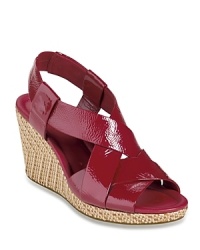 Slick patent is mixed with summery raffia on these Cole Haan sandals, utilizing Nike AIR technology for a shoe that's comfortable as well as stylish. Slick patent is mixed with summery raffia on these Cole Haan sandals, utilizing Nike AIR technology for a shoe that's comfortable as well as stylish.