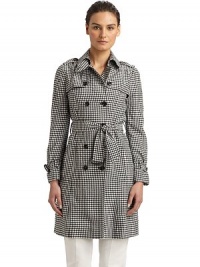 Youthful yet completely fashionable, this gingham design has a classic double breasted silhouette and tie-belt waist.Point collar with hook-and-eye closure Triangular button tab at collar Button down storm flap Shoulder epaulettes Long sleeves with belted cuffs Buckled belt at waist Dual vertical flap pockets Fully lined About 36 from shoulder to hem Rayon Dry clean Made in Italy Youthful yet completely fashionable, this gingham design has a classic double breasted silhouette and tie-belt waist.Point collar with hook-and-eye closure Triangular button tab at collar Button down storm flap Shoulder epaulettes Long sleeves with belted cuffs Buckled belt at waist Dual vertical flap pockets Fully lined About 36 from shoulder to hem Rayon Dry clean Made in Italy