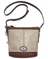 Simply chic, this classic crossbody from Fossil reels in old school charm with a contemporary attitude. Crafted from mod metallic suede and signature hardware, its pocket-lined interior keeps you organized anywhere.