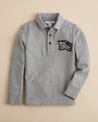 A classic long sleeve polo with a check-lined half placket. A classic long sleeve polo with a check-lined half placket.