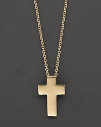 From the Tiny Treasures collection, a delicate pendant cross necklace in 18 Kt. yellow gold, with signature ruby accent. Designed by Roberto Coin.