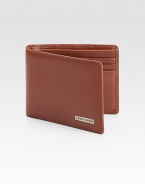 Modern classic bifold design features front logo plaque detail, three credit crad slots and one ID slot set in luxuriously soft leather.One billfoldThree card slotsOne clear identification windowLeather4W x 4H x 1DImported