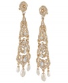Beautifully crafted with glass pearls and sparkling glass accents, Carolee's linear chandelier earrings add an elegant touch to your look. Set in gold tone mixed metal. Approximate drop: 3-1/2 inches.